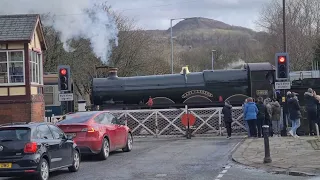 Cars wait as 'new' steam locomotive crosses main road in busy town 🚗 🚗 🚗