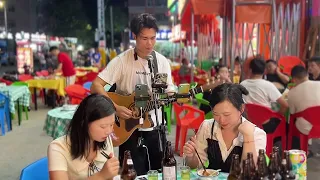 Play and sing the old song "兩隻蝴蝶" on guitar. When was the first time you heard this song?