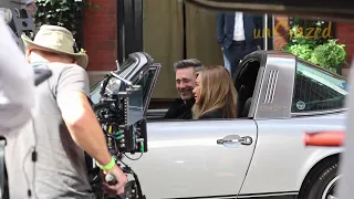 Jennifer Aniston and Jon Hamm on 'The Morning Show' set filming a scene in New York