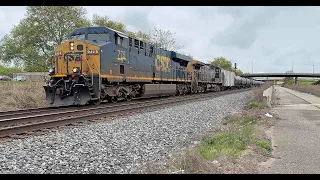 CSX 775 with loaded oil cans.