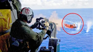 US Door Gunner Shooting Speeding Boat Target From Helicopter