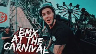 RIDING BMX AT A CARNIVAL