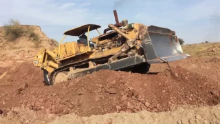 Old CAT dozer pushing!