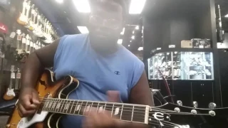 Playing an Epiphone Casino at the Guitar Center in Pasadena, California.