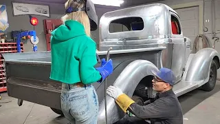 Jolene is butt welding the widened rear fender on the 1935 Plymouth