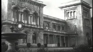 Civilians walk past buildings which will house the Yalta Conference members in Ya...HD Stock Footage