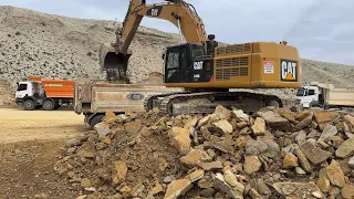 Caterpillar Excavator Loading stones onto trucks