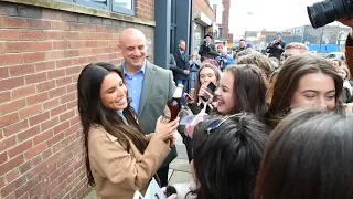 Cheryl is given a bottle of Newcastle Brown Ale by fan in Newcastle!