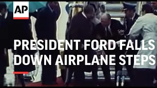 President Ford falls down airplane steps