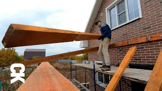 The guy builds a SINGLE ROOF on his own. Mauerlat installation