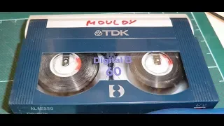 Repairing 8mm video tapes with mould and other damage.