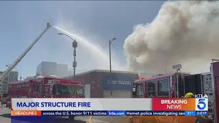 Crews battle raging structure fire in downtown L.A.