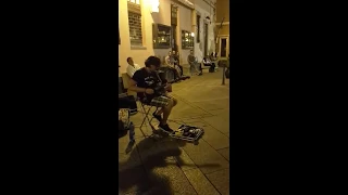 Street guitarist Marcello Calabrese plays "Comfortably Numb" of Pink Floyd in Villasimius