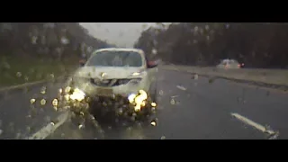 Nissan Juke pass high speed on shoulder in the wet