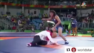 Japanese wrestler Risako Kawai throws coach on the mat after winning Olympic Gold
