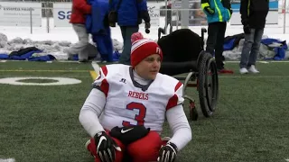 A football player unrestrained by his wheelchair