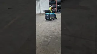 Eureka Rider 1201 ride on battery operated factory/warehouse sweeper in action.