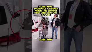 this woman checking out a car!