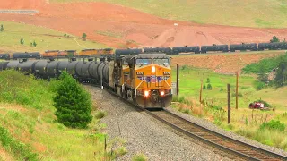 Long Union Pacific loaded oil train coming down steep grade the Moffat Route