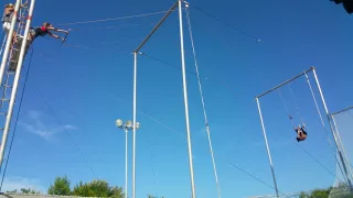 Flying trapeze penny roll catch