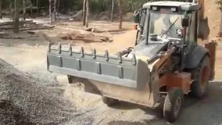 Loader Backhoe with a Bottom Dump (BDB / 6 in 1) Bucket in application