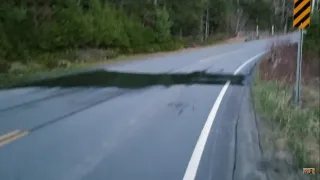 River Crumbling Road And Metal Culvert With Concrete Floor