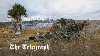 Migrant camps cleared at Belarus-Poland border as thousands more moved to warehouse