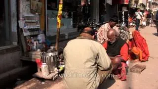 Varanasi roadside dentist working on a denture