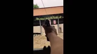 Firing a Beretta 92FS in slow motion.