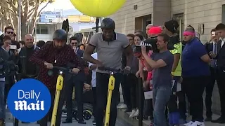 Usain Bolt unveils electric scooters in Paris demonstration