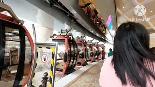 Riding a cable car at Wynn Palace Macau