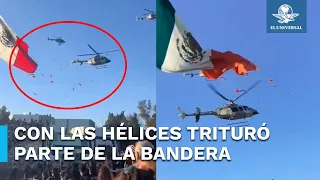 Helicóptero de la Sedena corta parte de la bandera de México en el Campo Militar 1