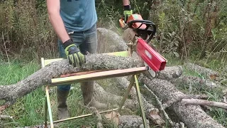 Firewood Log Stand With a Chainsaw