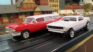 Plymouth Cuda & Cadillac Ambulance Auto World 4 Gear Slot Cars on Model Railroad Layout.