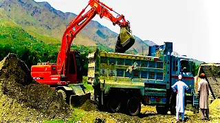 Excavator crawler crane and construction trucks railway bridge repair