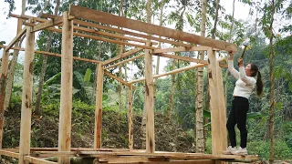 The girl started building a wooden house (build log cabin) to live alone with nature