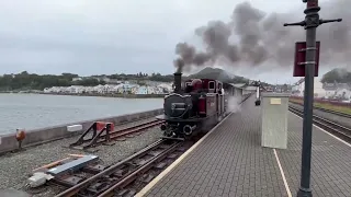 Train 'Merddin Emrys' disappears in steam on the Ffestiniog Railway as it leaves Porthmadog Station