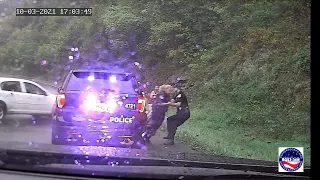 Virginia policeman saves fellow officer from an oncoming car 10 -3-2021