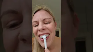Electric toothbrushing with toothpaste