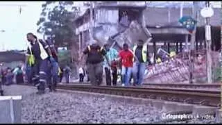 South Africa building collapse: rescue workers pull survivors from the rubble