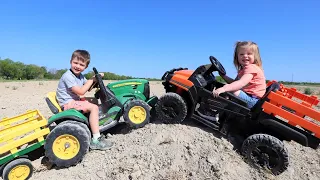Using kids tractors to move dirt into the water | Tractors for kids