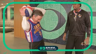 Harlem Globetrotters teach Jim Donovan and Chandler Lutz some new tricks