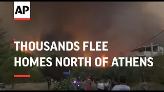 Thousands flee homes north of Athens as fires rage