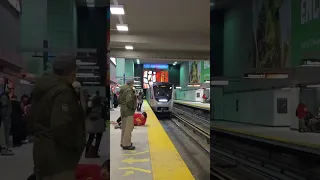 Guy lays down next to the tracks at Montreal metro station