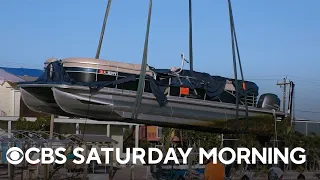 Recovering boats left derelict by Hurricane Ian