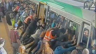 Crowd Lifts 43-Ton Train to Save Trapped Man