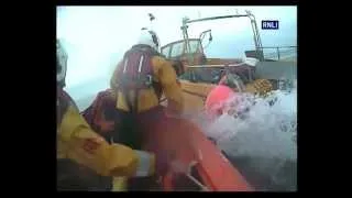 Rescue at Sea: RNLI Lifeboat Team Rescues Fisherman and Runaway Boat