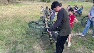 Firing a compound bow...youth shooting demo