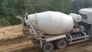 How does a day work on an toll road construction project?  dump truck Hauling Stockpiled material