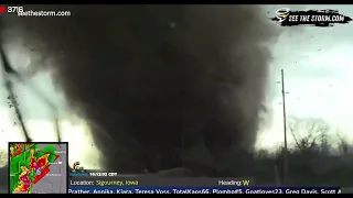 Tornado swirls debris across road in front of storm chasers in Harper, Iowa